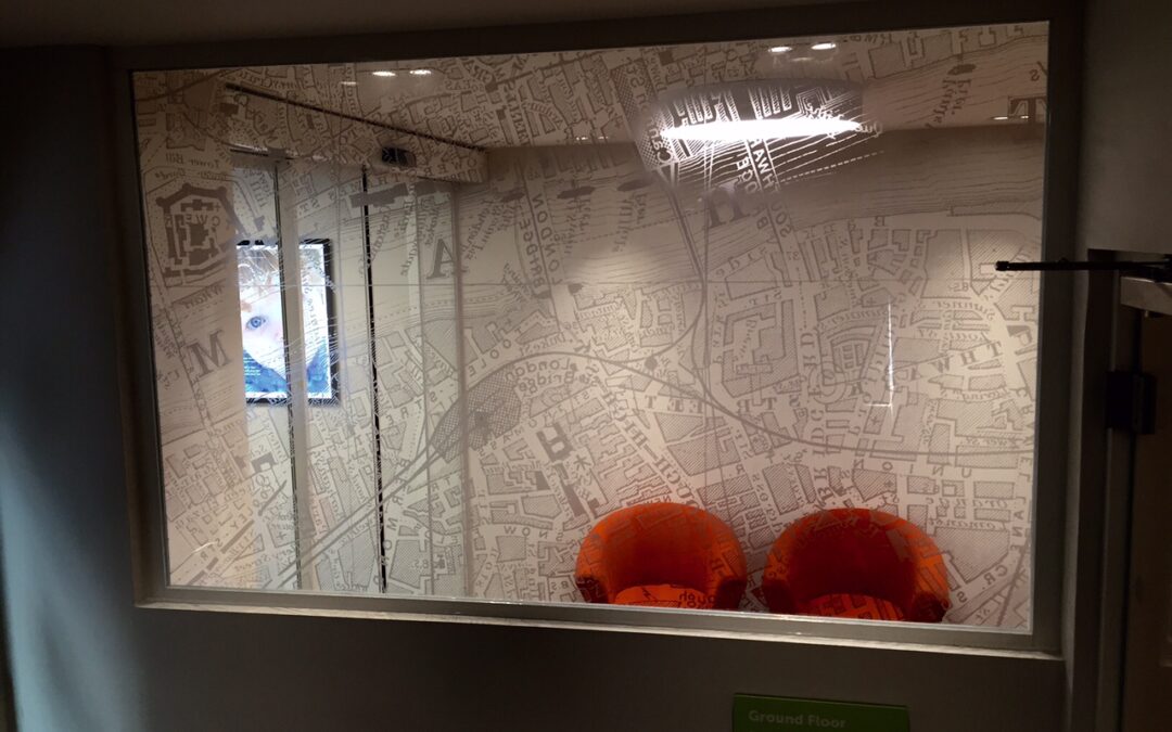 Mono screens and optically clear glass manifestation with a London theme for a clinic in SE1